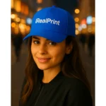 Șapcă albastră personalizată cu nume, inscripționată iRealPrint, stil modern și versatil, perfectă pentru echipe și cadouri