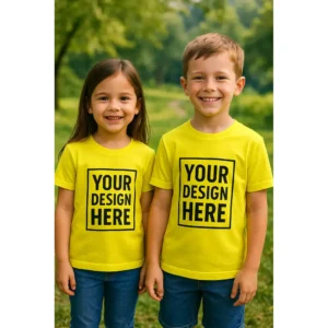 Tricou copii personalizat galben lămâie iRealPrint – băiat și fată purtând tricouri Your Design Here, fundal natural verde, culoare galben intens, contrast puternic și vizibilitate maximă pentru personalizare.