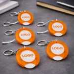 Set brelocuri cu fisă de cumpărături personalizat portocaliu, prezentare promoțională pentru campanii retail și distribuție în volum mare