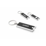 Breloc cu lumină LED negru cu logo personalizat, aspect corporate elegant și mini lanternă practică pentru evenimente business și fidelizare