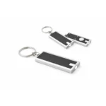 Breloc cu lumină LED personalizat negru în perspectivă oblică, mini lanternă elegantă cu finisaj premium pentru campanii corporate