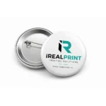 Insigna personalizata 44mm cu logo iRealPrint, model metalic cu ac de prindere, ideala pentru branding vizibil si campanii promotionale